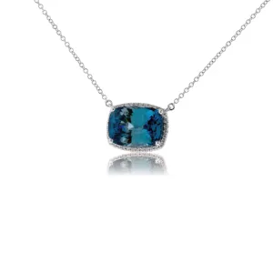 Stunningly Simple Blue Zircon and Diamond Halo Pendant